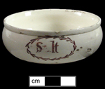 Enameled Creamware salt dish with the work "Salt" painted in red.